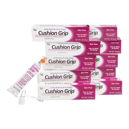 Cushion Grip denture adhesive packaging on a white background