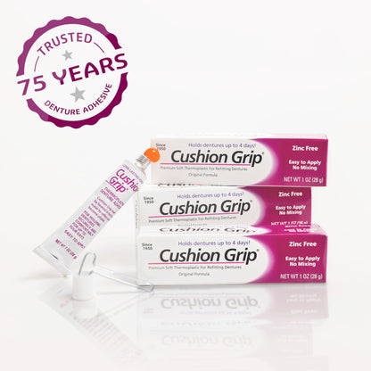 Cushion Grip denture adhesive packaging with a 75-year trust badge on a white background