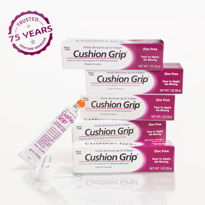 Cushion Grip denture adhesive packaging with a 75-year trust badge on a white background