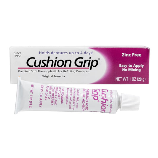 Cushion Grip denture adhesive packaging on a white background