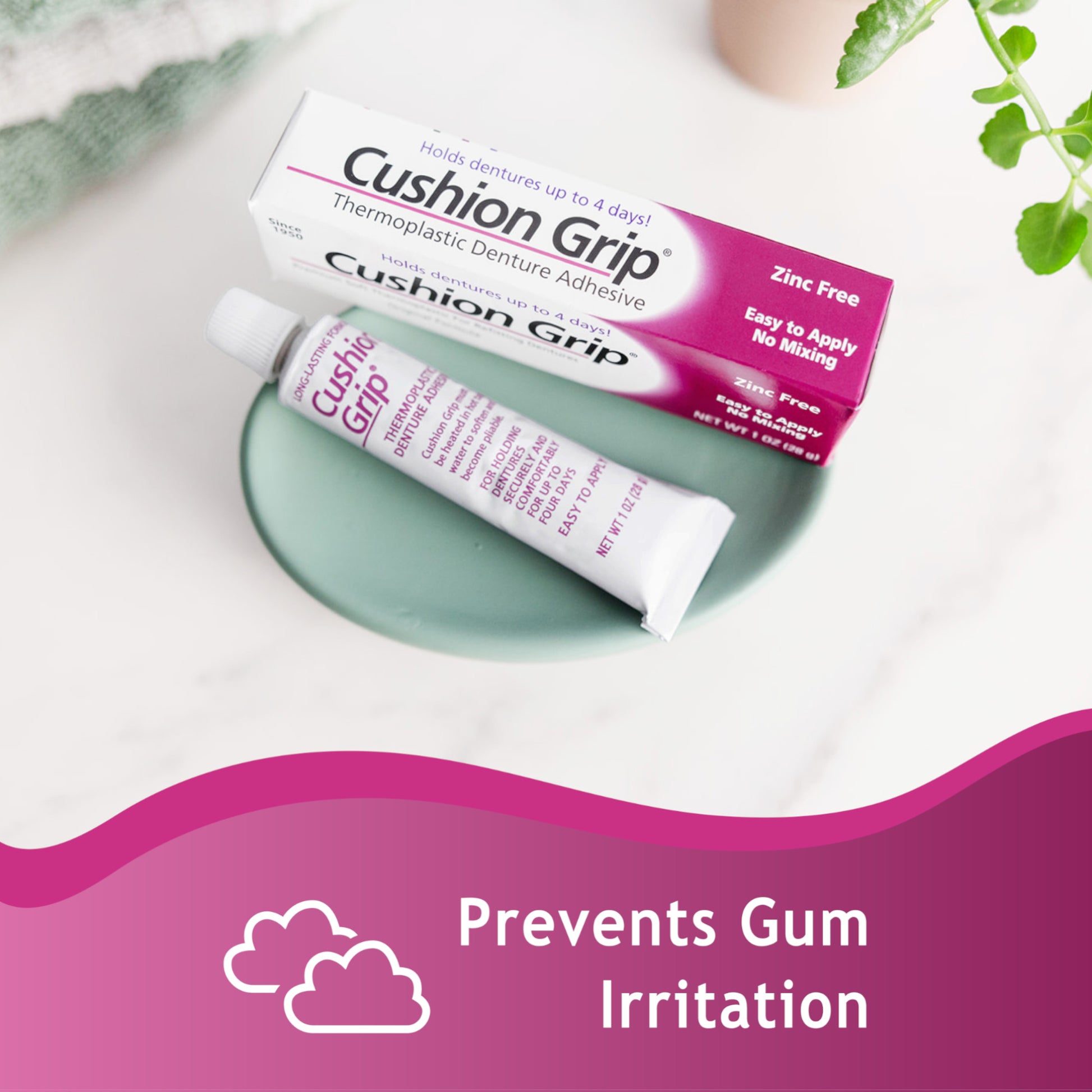 Cushion Grip denture adhesive packaging on a white surface with greenery.