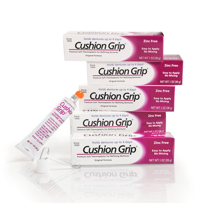 Cushion Grip denture adhesive packaging on a white background